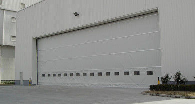 comprar Puertas de elevación vertical de tejido industrial de alta resistencia con una altura máxima de 12 metros y resistencia al viento de hasta 120 km/h, ideales para almacenes online manufacture